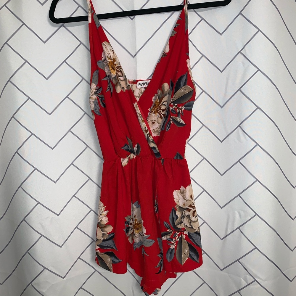 Reverse floral romper size 8